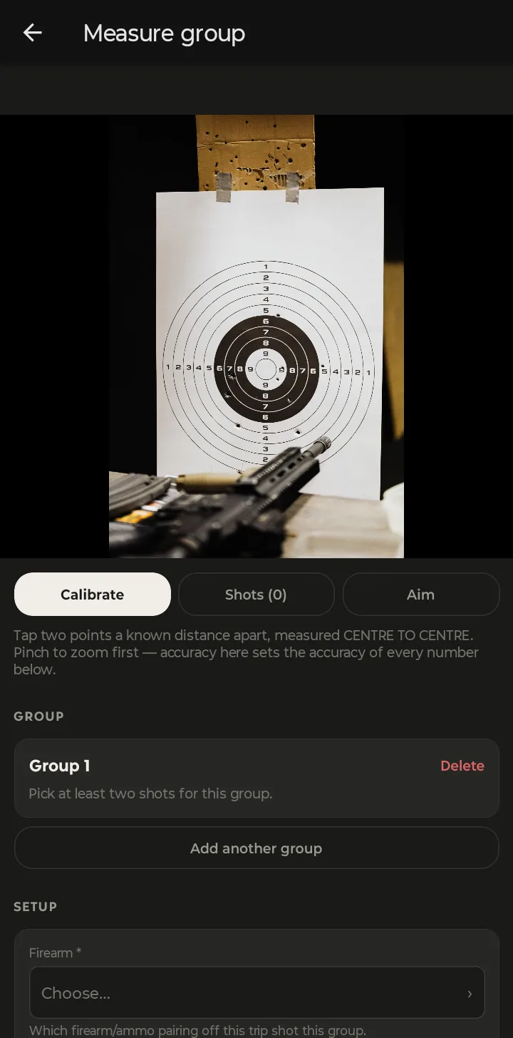 The Measure group screen: the target photo with Calibrate, Shots and Aim tabs, calibration instructions, and a Setup section asking which firearm fired this group